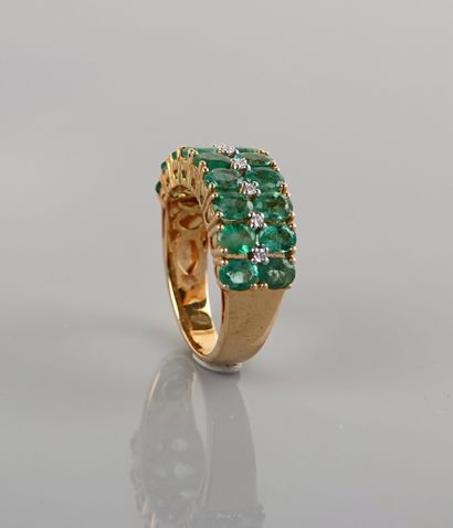 null Ring in yellow gold, 750 MM, set with oval emeralds interspersed with diamonds,...