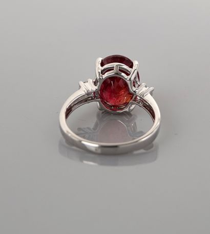 null Ring in white gold, 750 MM, set with an oval ruby weighing 6.22 carats accompanied...