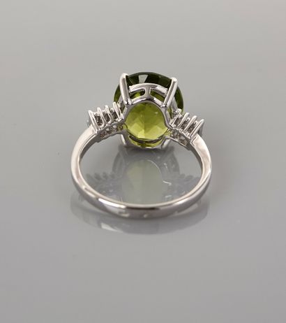 null Ring in white gold, 750 MM, set with an oval peridot weighing 5.07 carats with...