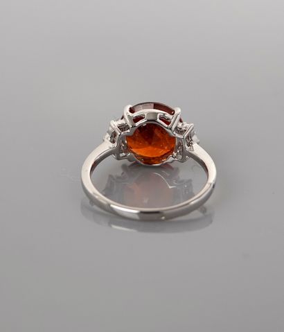 null Ring in white gold, 750 MM, set with a round spessartite weighing 5 carats between...