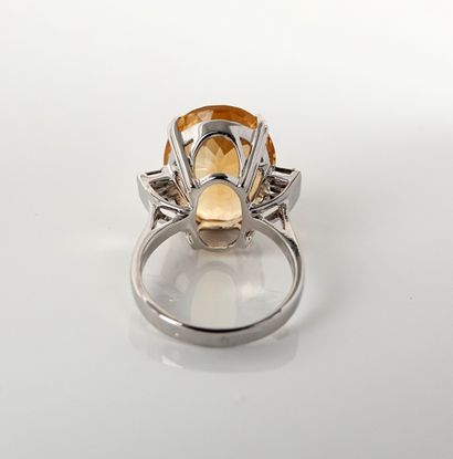 null Ring in white gold, 750 MM, set with an oval citrine weighing 11 carats, with...