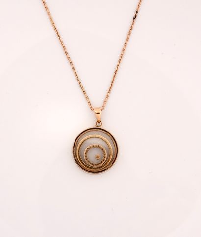 null Chain and round pendant in yellow gold, 750 MM, decorated with a spiral of diamonds,...