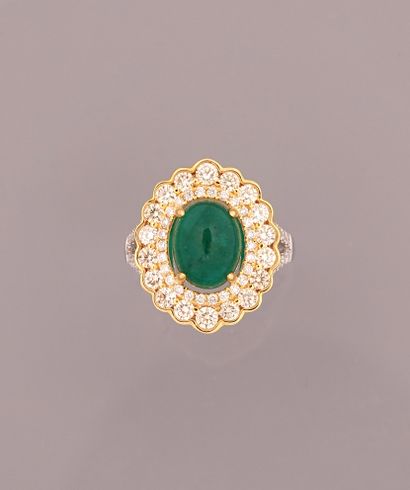 null Ring in white gold, 750 MM, centered on a cabochon emerald weighing 3.20 carats...