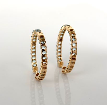 null Yellow gold oval hoop earrings, 750 MM, underlined on two faces of oval blue...