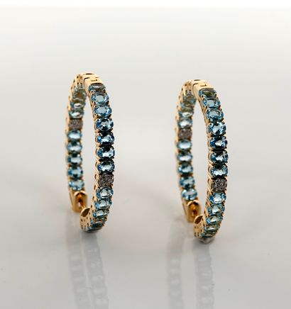 null Yellow gold oval hoop earrings, 750 MM, underlined on two faces of oval blue...