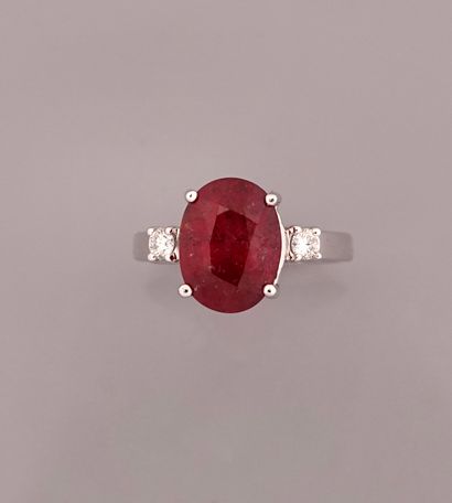 null Ring in white gold, 750 MM, set with an oval ruby weighing 6.22 carats accompanied...