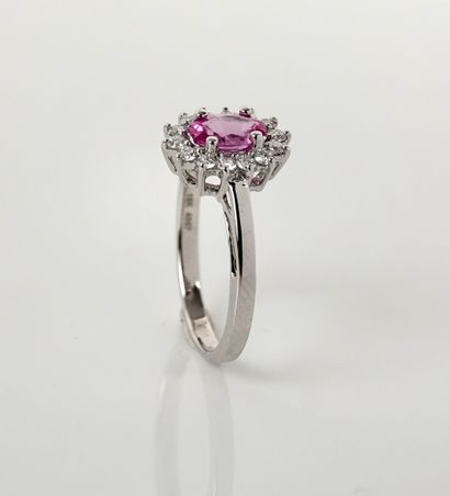 null White gold ring, 750 MM, centered on an oval pink sapphire weighing 0.75 carat...
