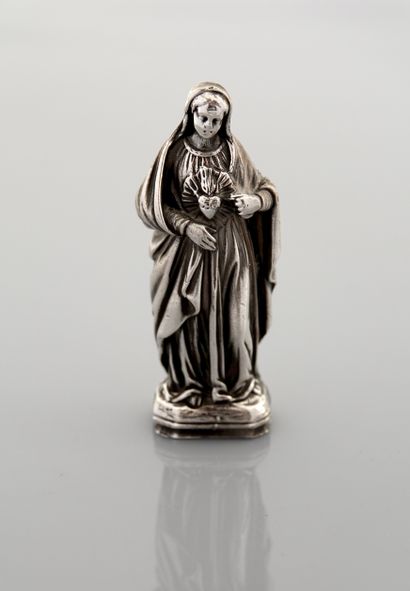 Statuette représentant la Vierge Marie montrant...