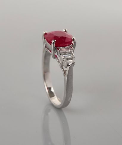 null Ring in white gold, 750 MM, set with an oval ruby weighing 3 carats with six...