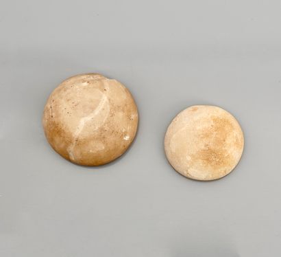 null Set of two cups or stoppers, one of which is decorated with engraved hieroglyphs
Alabaster
5...