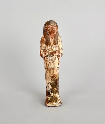 Mummiform funerary servant, wearing a wig,...