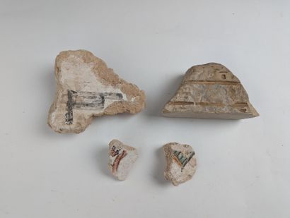 Set of four fragments, a carved element with...