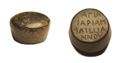 null Bronze weight (probably half Deben) 
Inscription on the back 
Diam. 2,3 cm 
Weight...