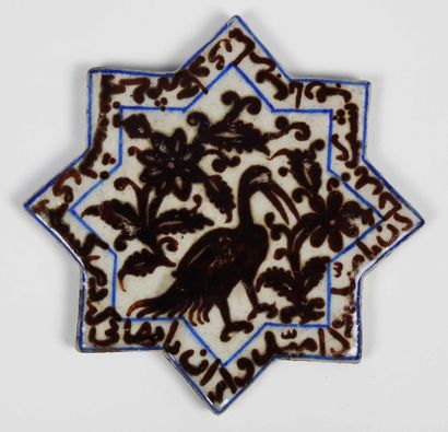 null Octagonal tile in polychrome ceramic Kashan style representing a bird in a pattern...