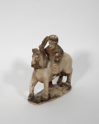 null Man on horseback holding a pyxis and a scroll 
Alabaster remains of polychromy...