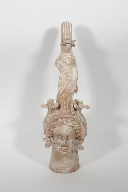 null Dummy vase decorated with a female head surmounted by flowers and a draped female...