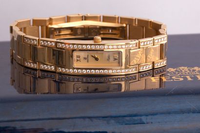 null FESTINA. Bracelet-montre de dame en or 18k FESTINA, boîtier rectangulaire souligné...