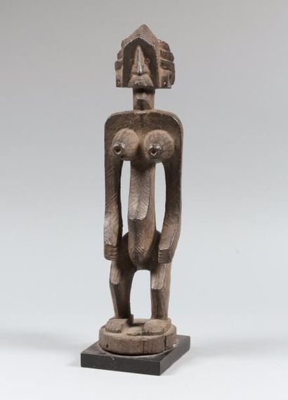 DOGON, Mali 
Statuette d'une jeune femme représentée debout
Nombreuses scarifications...