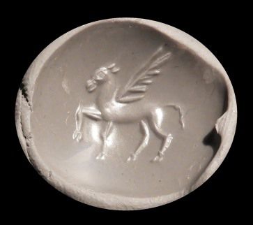 null Sceau lentoïde gravé d'un cheval et d'une palme.Agate.
Art grec.Ier mil av J.C.
L:...