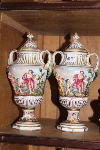 null Capo di Monte. Pair of small polychrome porcelain pots with rotating decoration...