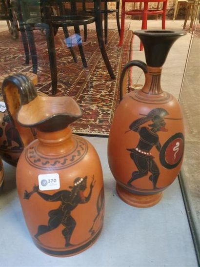 null Two terracotta jugs decorated with war scenes in the Ancient
Italian style:...