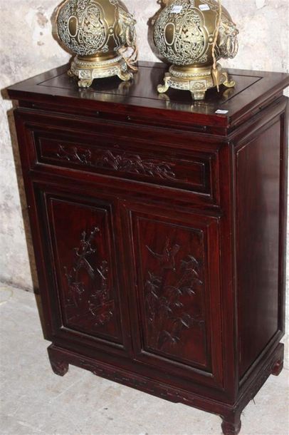null Small in-between piece of furniture in exotic wood molded and carved with trendy...