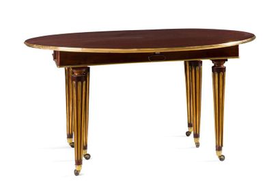 null A circular, two-flap, two-panel dining room table in mahogany
, resting on six...