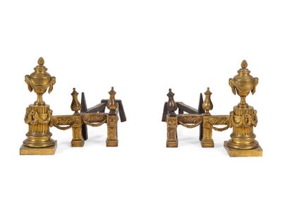 null PAIR OF GOLDEN
BRONZE CHENETS decorated with vases with antique women's masks...