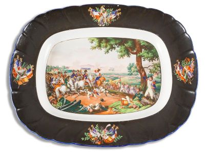 null Oval plate in fine
earthenware with polychrome decoration of a scene of combat...