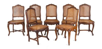 null SUITE OF FOUR CHAIRS
Moulded and sculpted walnut cane base, decorated with foliage...