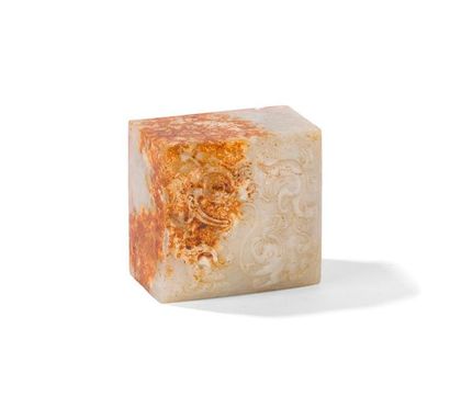 null WHITE AND RUST JADE CACHET
China
Square section, the top carved in slight relief...