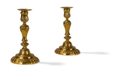 null Pair of BRONZE FLAMBEAUX GOLDEN
the barrel in baluster with foliated cartridge...