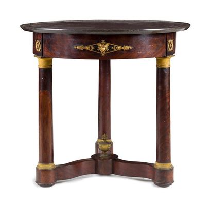 null CIRCULAR TABLE IN CASHWOOD
with three uprights in column joined by a spacer...