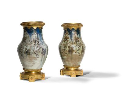 null AUGUSTE DELAHERCHE (1857-1940) Delta
eyelets
Pair of baluster vases mounted...