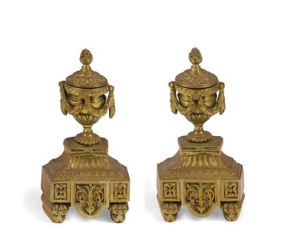 null A PAIR OF BRONZE
WOODEN OAKS (dedicated and repolished) with vases, garlands...