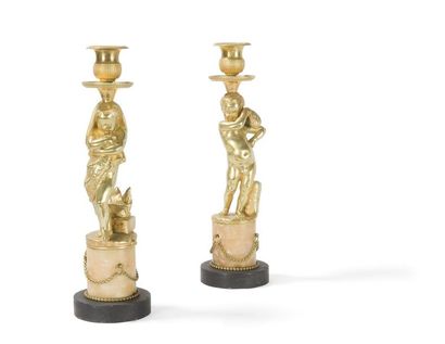 null Pair of VERNISHED
BRONZE FLAMBEAUX in white and black marble with a child
's...