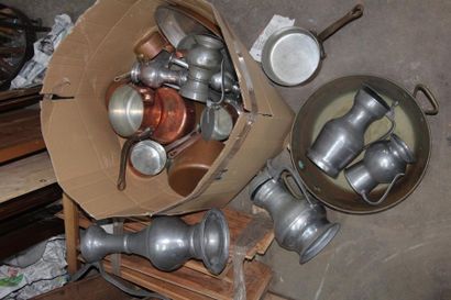 null In a cardboard box, a set of brass instruments and pewter, including pots, pans,...