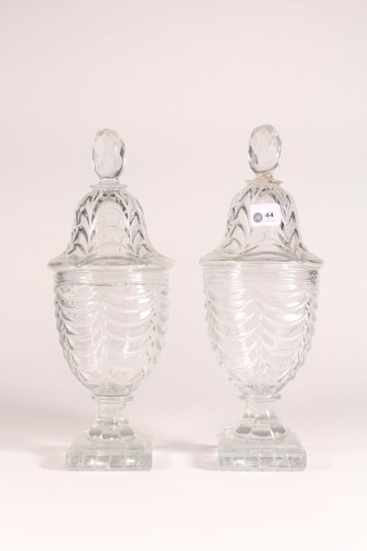 null Pair of covered vases in the shape of moulded crystal urns, the square base,...