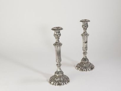 null Christofle, pair of silvered bronze candlesticks, the base scrolled, the base...