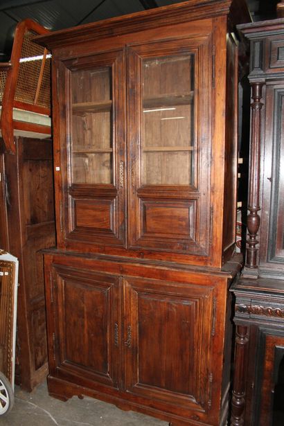 null Moulded and stained walnut sideboard with two lower leaves and two upper glass...