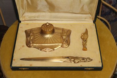 null Desk set in gilt bronze : 

an inkwell, a letter opener and a stamp.

Signed...