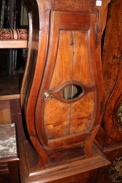 null Moulded walnut parquet clock with a moving form

The enamelled dial is decorated...
