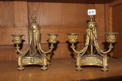 null Pair of gilt bronze table ends decorated with garlands of foliage and chains...