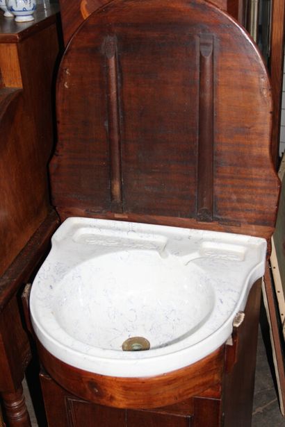 null Mahogany and earthenware bathroom furniture, a flap revealing a washbasin and...