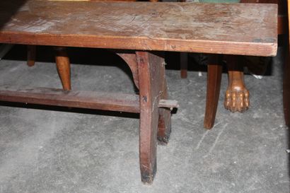 null Rustic oak table, legs joined by a spacer bar.

A stained wooden bench and 3...