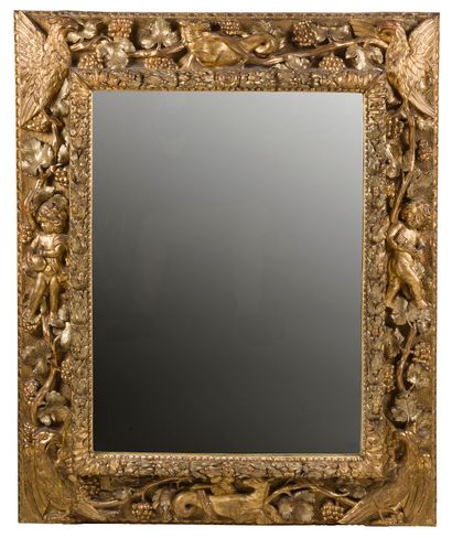 null CARVED AND GILDED WOODEN MIRROR

Rectangular in shape, decorated with vine branches,...