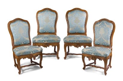 null SUITE OF FOUR CARVED WALNUT CHAIRS

of a lively shape with asymmetrical foliage...
