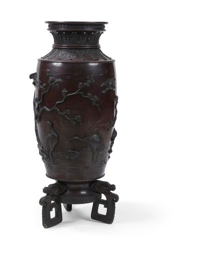 null LARGE METAL VASE WITH BROWN PATINA

with relief decoration of stylized birds...