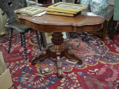 null Pedestal table in walnut, violin top, base with stylized foliage decoration...