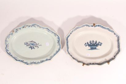 null Two oval dishes in regional earthenware of the 18th century, decorated in blue...